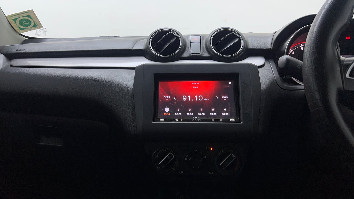 Used 2021 Maruti Suzuki Swift VXi Petrol Manual top_features Integrated (in-dash) music system