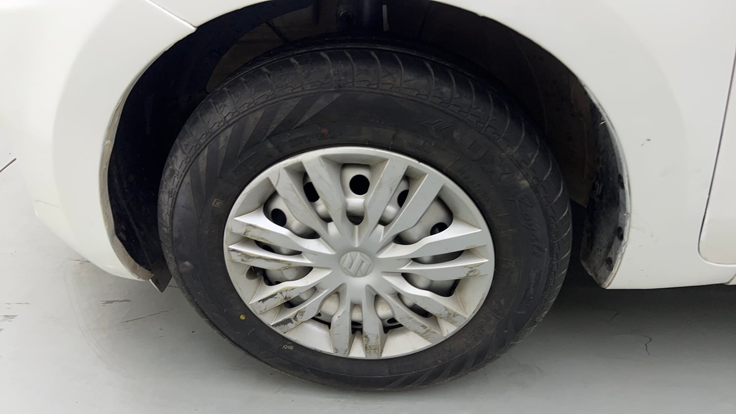 Used 2022 Maruti Suzuki Swift LXi Petrol Manual tyres LEFT FRONT TYRE RIM VIEW