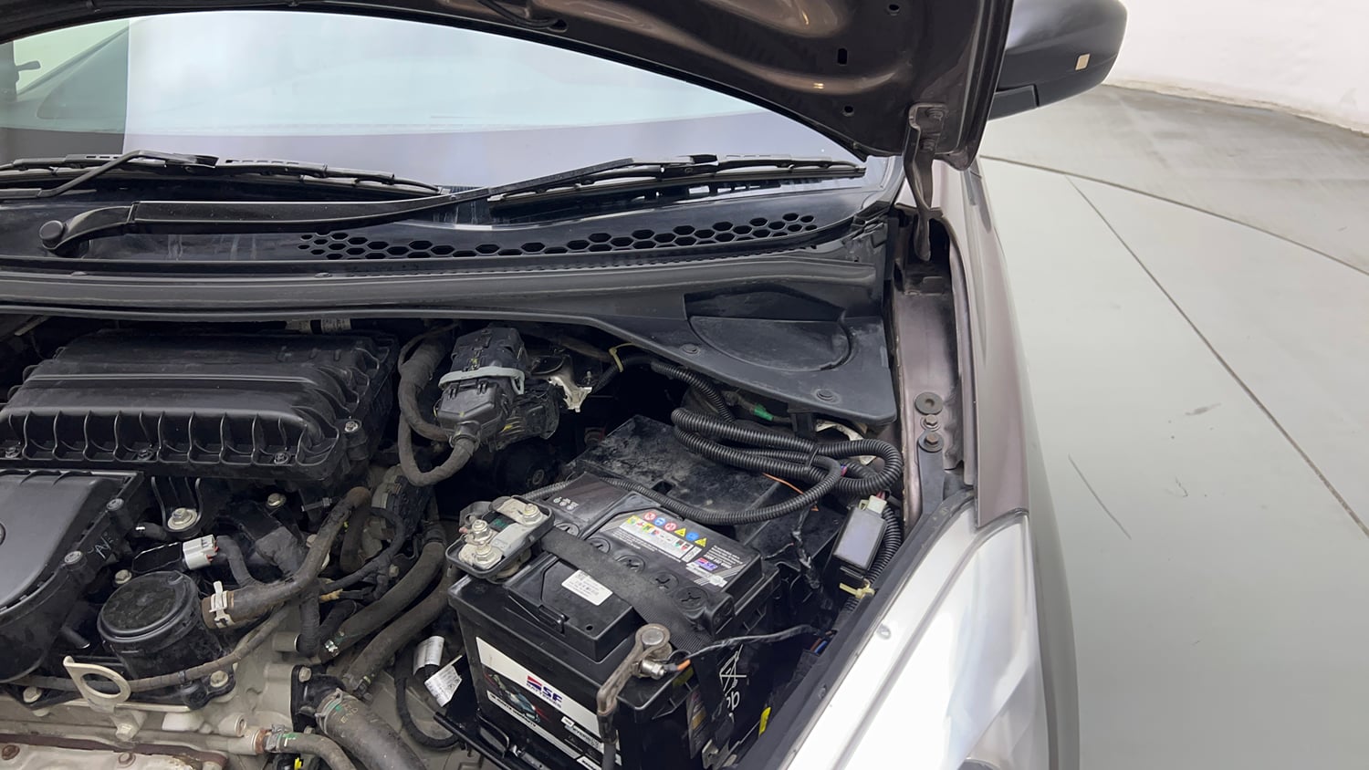 Used 2019 Tata Tiago Revotron XE Petrol Manual engine ENGINE LEFT SIDE HINGE & APRON VIEW