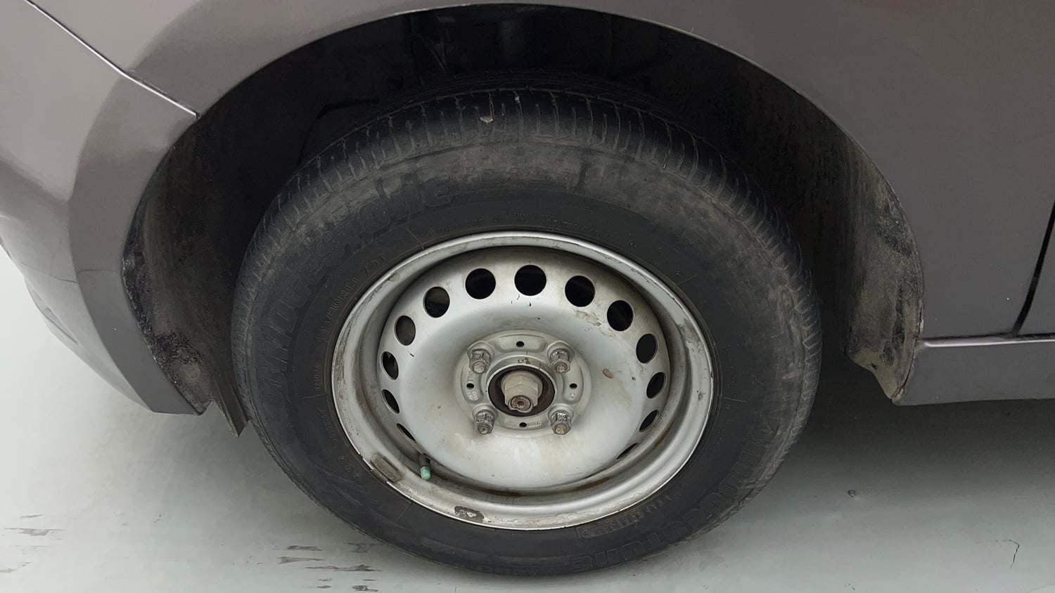 Used 2019 Tata Tiago Revotron XE Petrol Manual tyres LEFT FRONT TYRE RIM VIEW