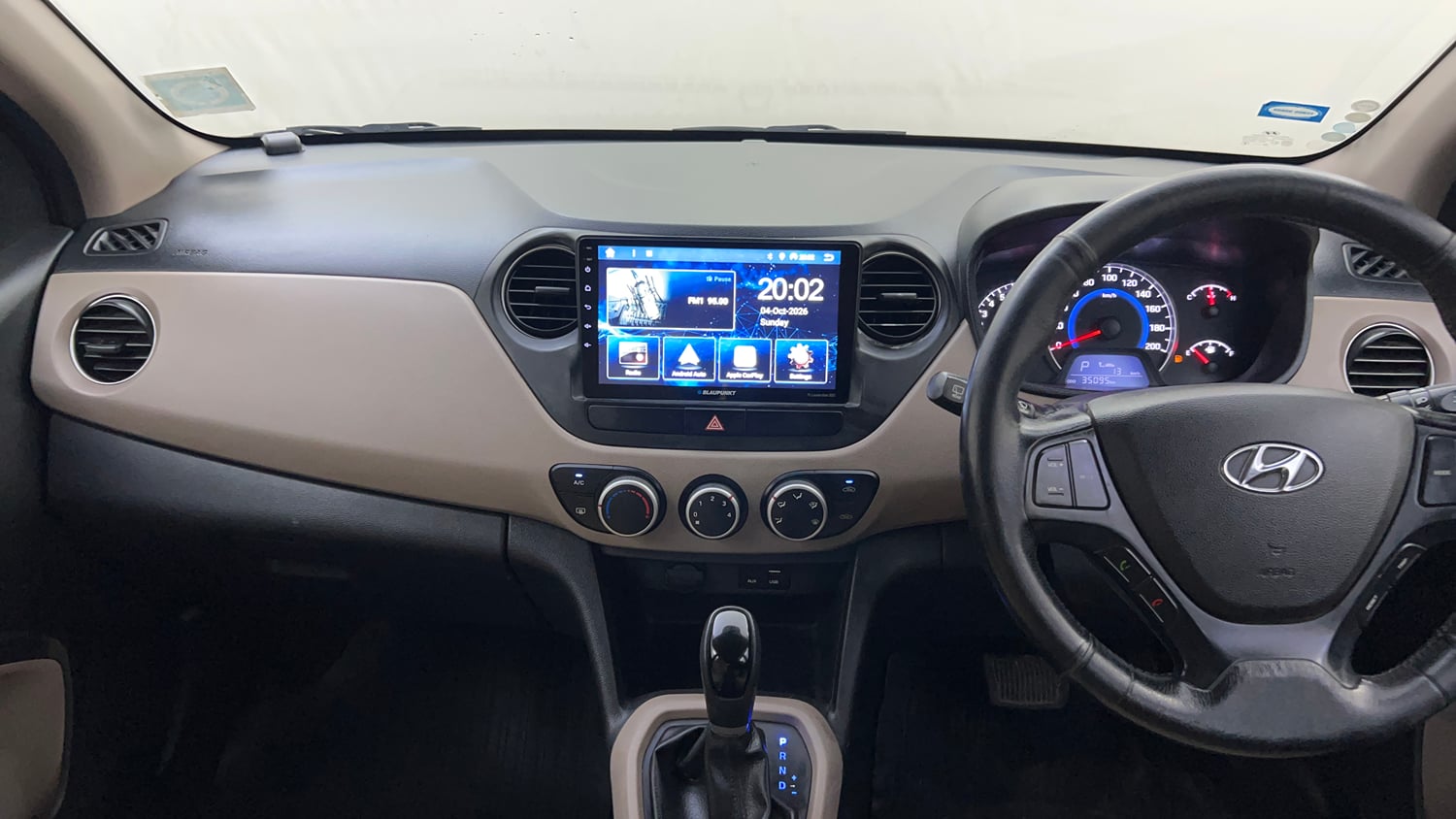 Used 2016 Hyundai Grand i10 Asta AT 1.2 Kappa VTVT (O) Petrol Automatic interior MUSIC SYSTEM & AC CONTROL VIEW