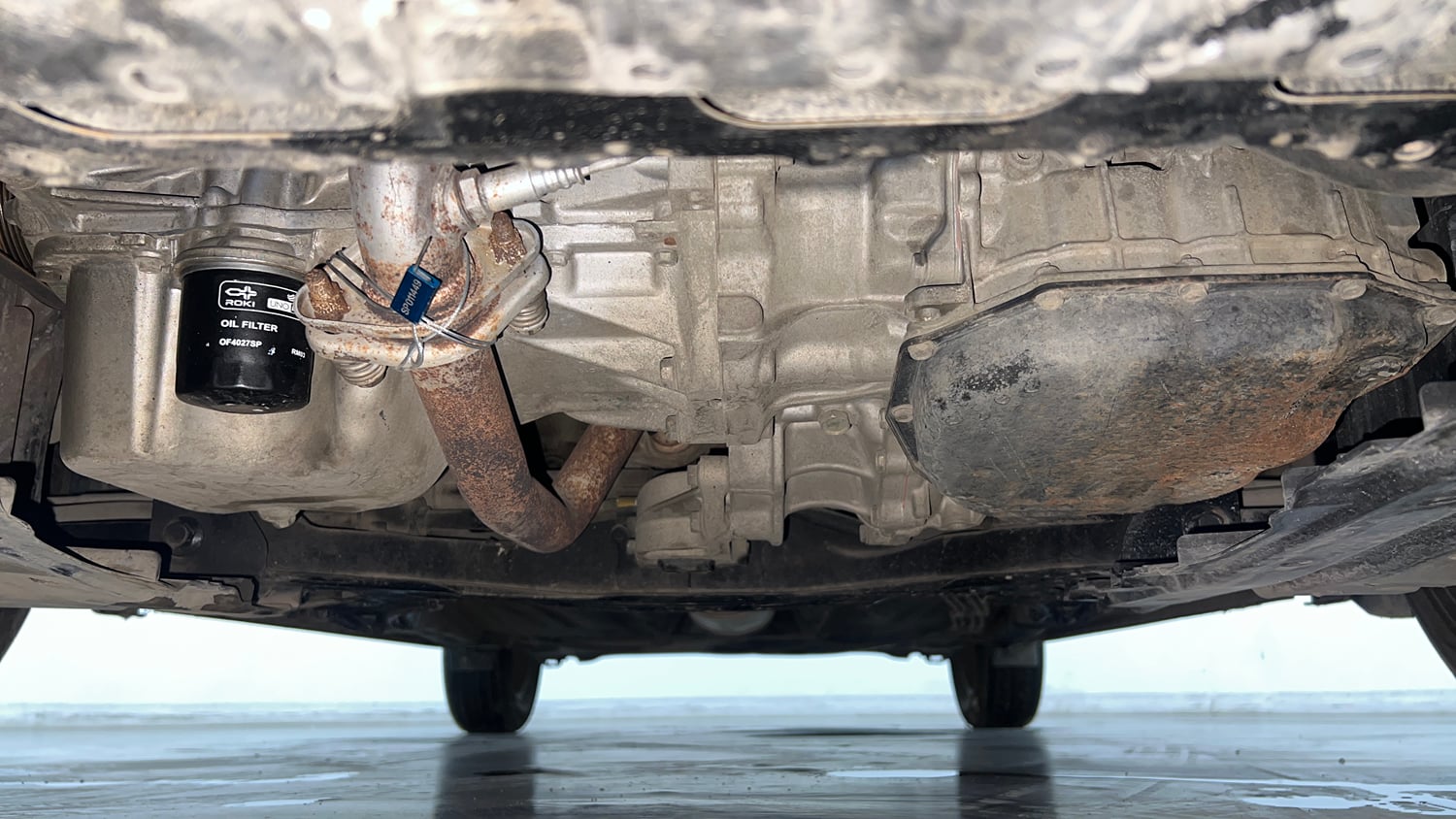 Used 2016 Maruti Suzuki Baleno Delta 1.2 AT Petrol Automatic extra FRONT LEFT UNDERBODY VIEW