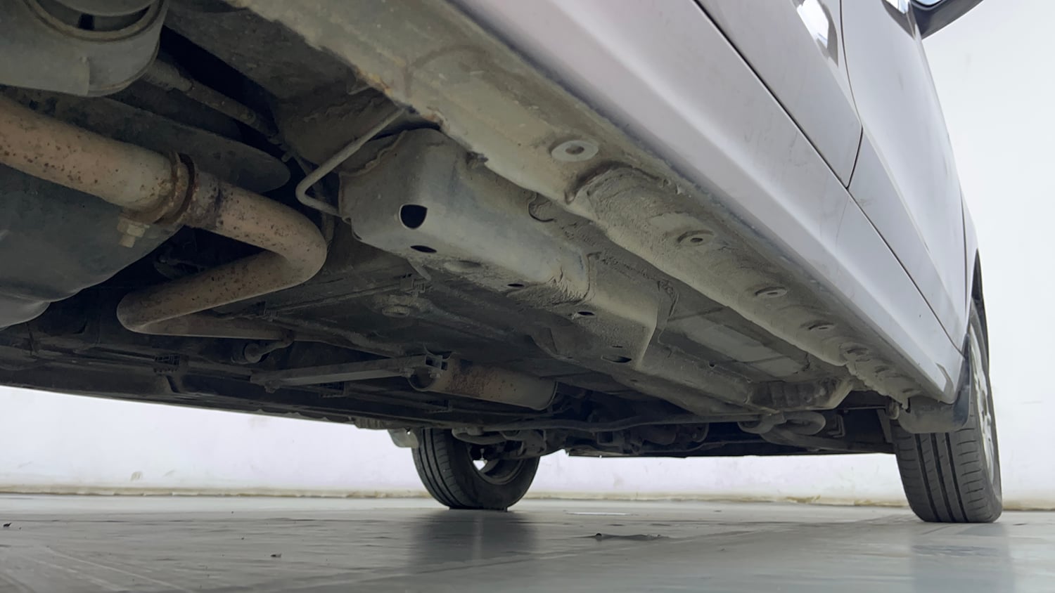 Used 2016 Tata Tiago Revotron XZ Petrol Manual extra REAR RIGHT UNDERBODY VIEW