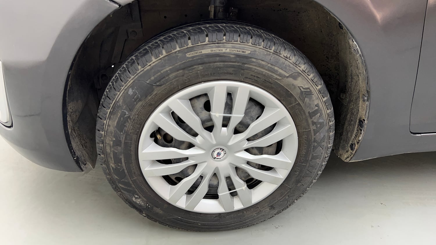 Used 2015 Maruti Suzuki Swift VXi Petrol Manual tyres LEFT FRONT TYRE RIM VIEW