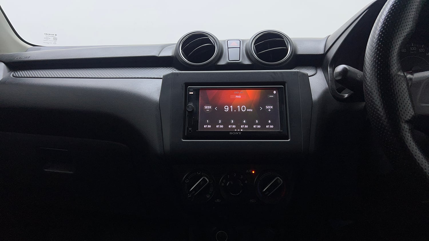 Used 2019 Maruti Suzuki Swift LXi Petrol Manual interior MUSIC SYSTEM & AC CONTROL VIEW