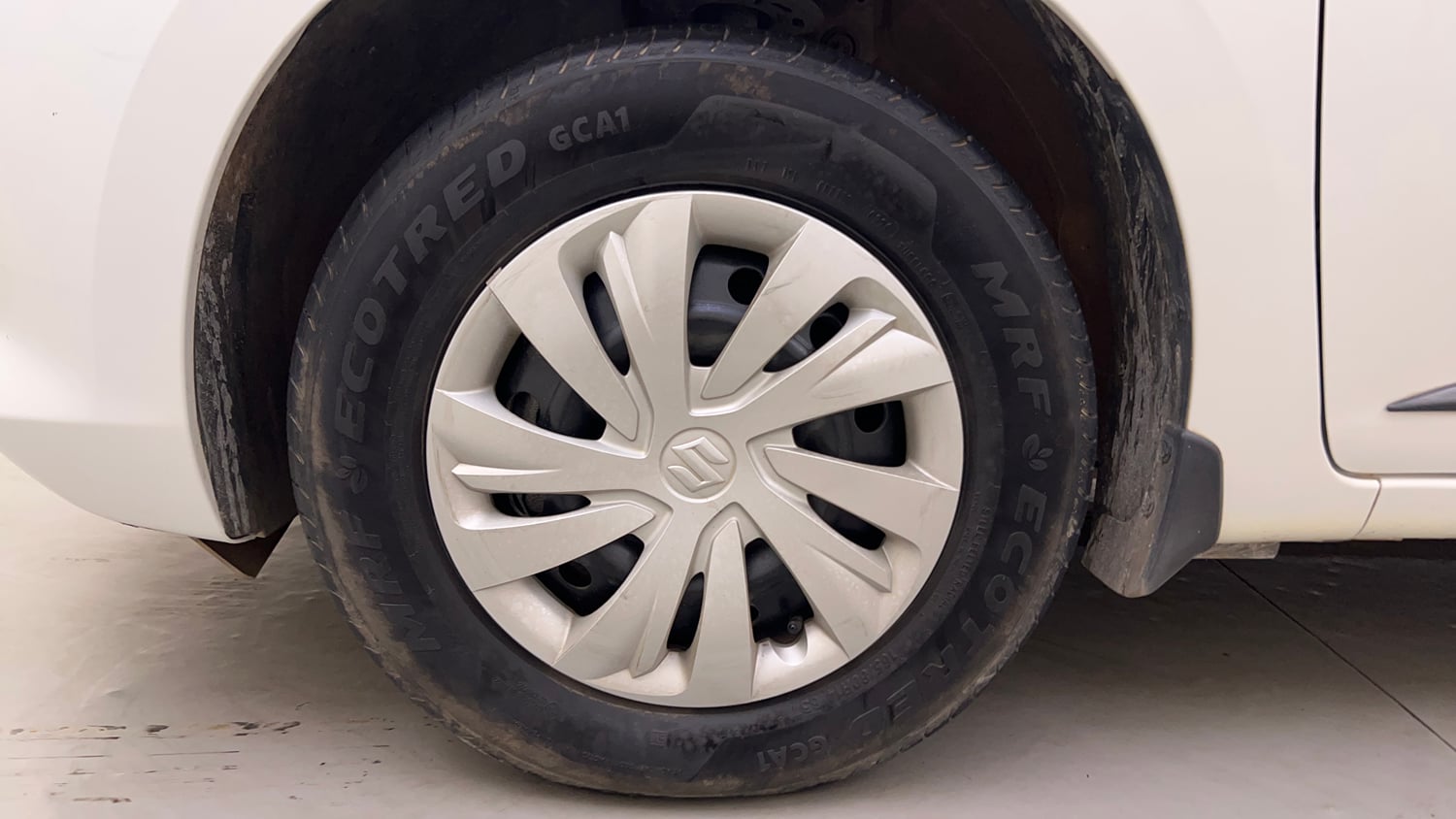 Used 2026 Maruti Suzuki Swift VXi AMT Petrol Automatic tyres LEFT FRONT TYRE RIM VIEW