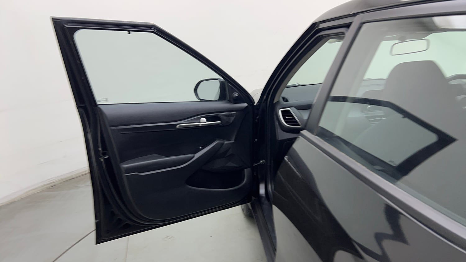 Used 2025 Kia Seltos HTE (O)1.5 Petrol MT Petrol Manual interior LEFT FRONT DOOR OPEN VIEW