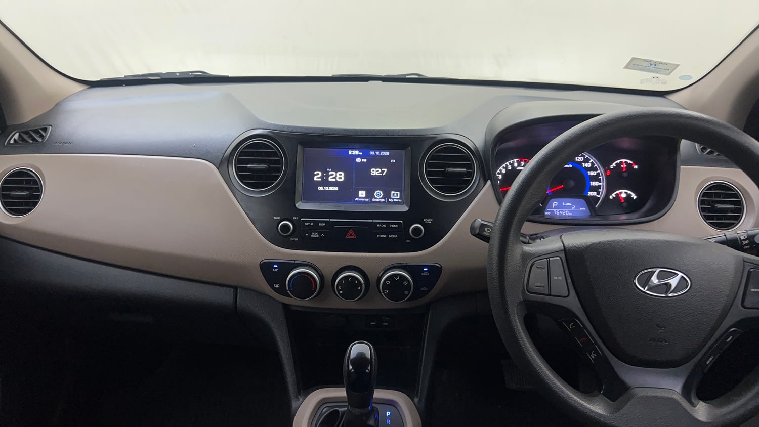 Used 2018 Hyundai Grand i10 Sportz AT 1.2 Kappa VTVT Petrol Automatic interior MUSIC SYSTEM & AC CONTROL VIEW