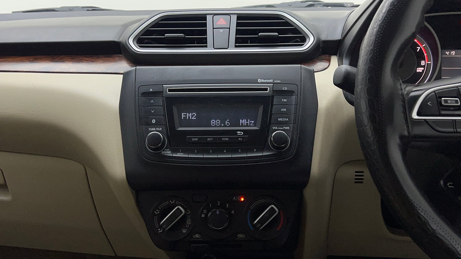 Used 2018 Maruti Suzuki Dzire VXi Petrol Manual top_features Integrated (in-dash) music system