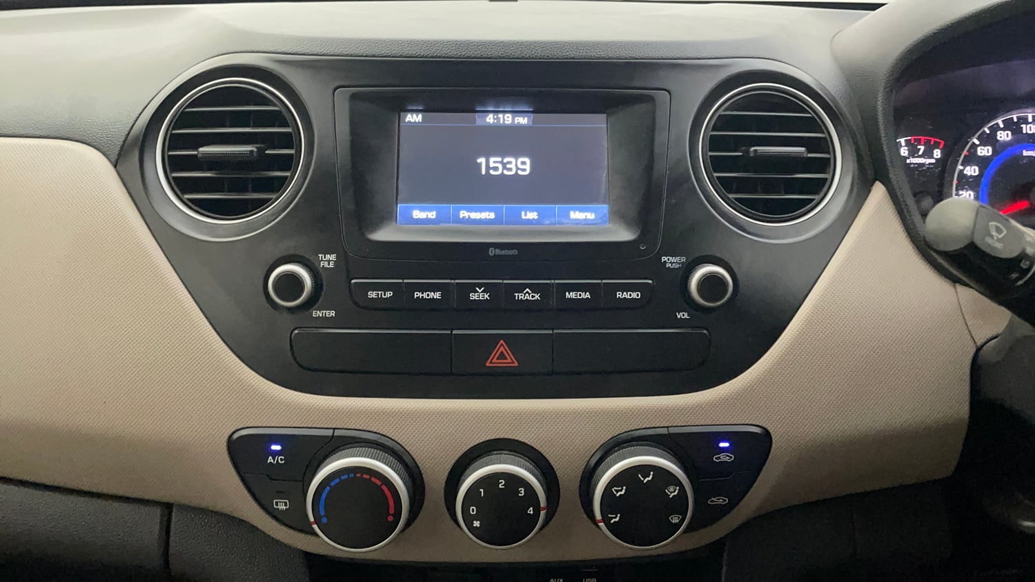Used 2018 Hyundai Grand i10 Sportz 1.2 Kappa VTVT Petrol Manual top_features Integrated (in-dash) music system
