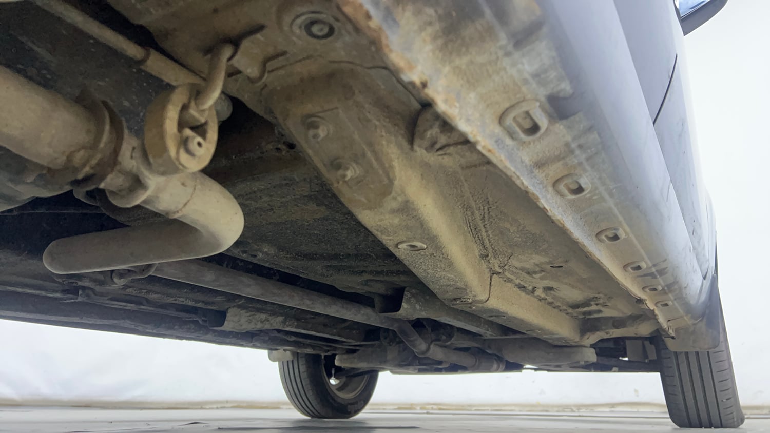 Used 2015 Tata Zest XT Petrol Petrol Manual extra REAR RIGHT UNDERBODY VIEW