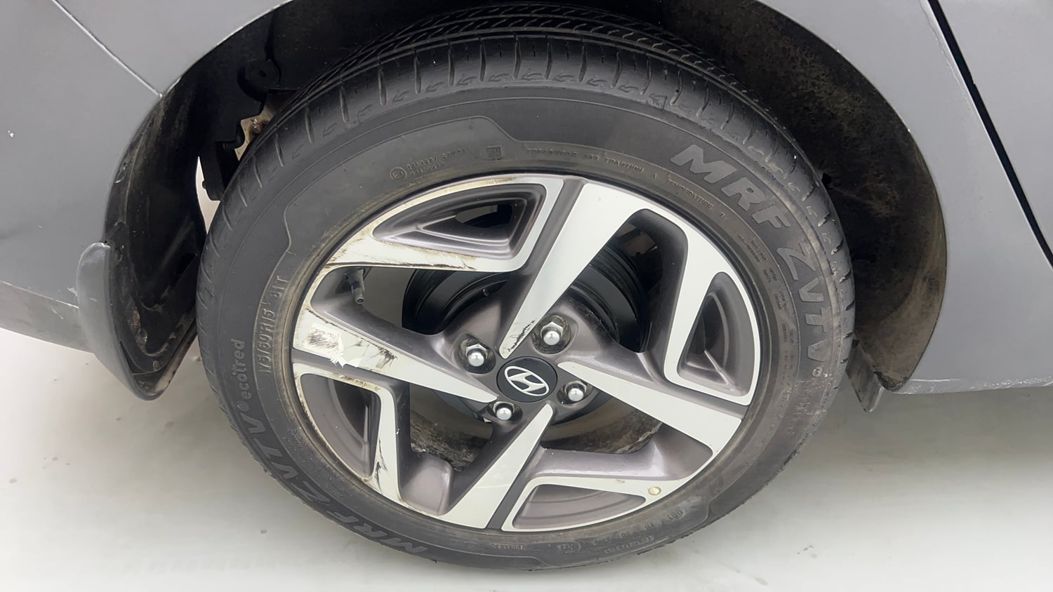Used 2023 Hyundai Aura SX 1.2 Petrol Petrol Manual tyres RIGHT REAR TYRE RIM VIEW