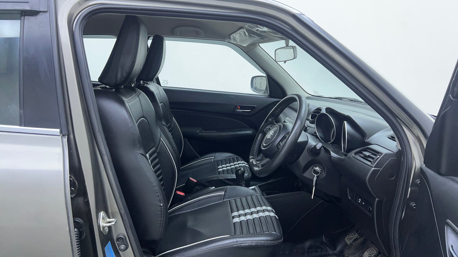 Used 2022 Maruti Suzuki Swift VXi Petrol Manual interior RIGHT SIDE FRONT DOOR CABIN VIEW