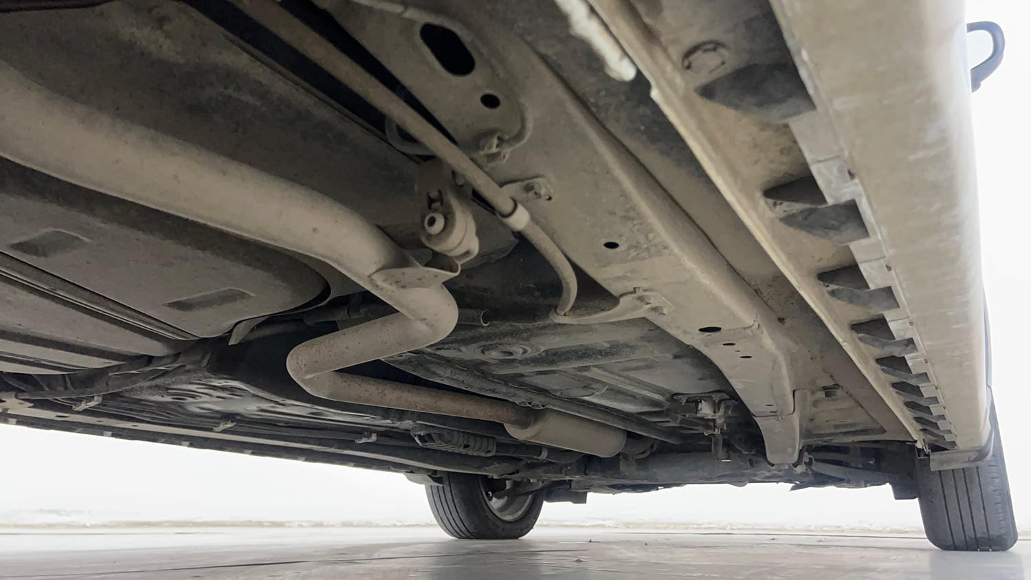 Used 2022 Maruti Suzuki XL6 Alpha MT Petrol Petrol Manual extra REAR RIGHT UNDERBODY VIEW