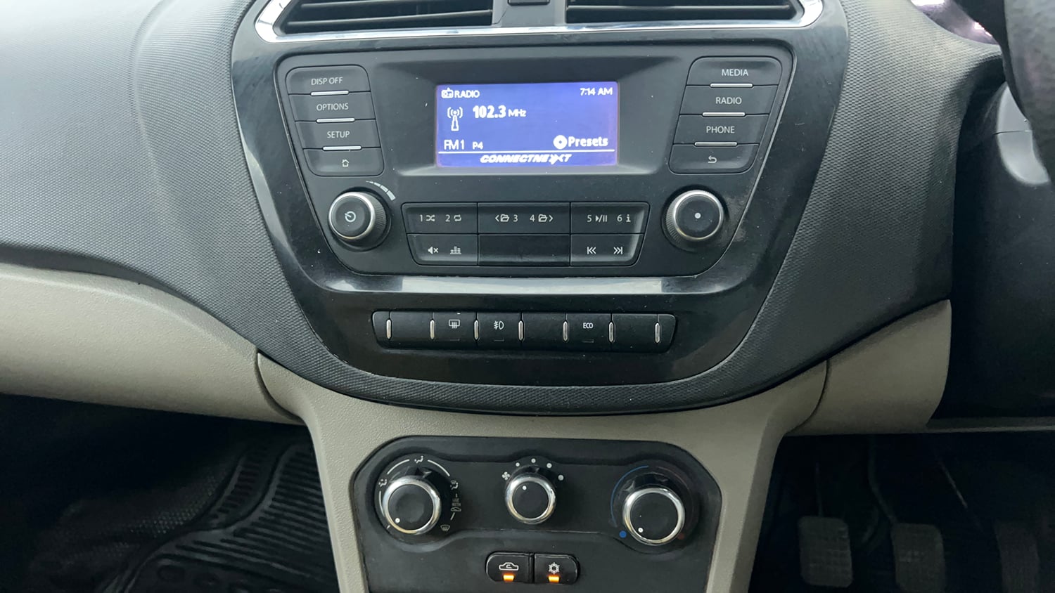Used 2016 Tata Tiago Revotron XZ Petrol Manual interior MUSIC SYSTEM & AC CONTROL VIEW
