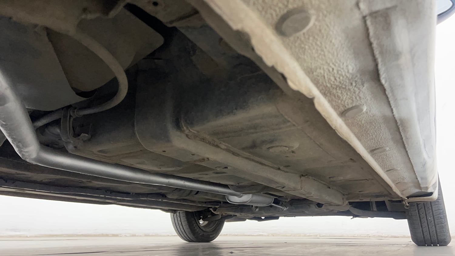 Used 2018 Hyundai Grand i10 Sportz (O) AT 1.2 Kappa VTVT Petrol Automatic extra REAR RIGHT UNDERBODY VIEW