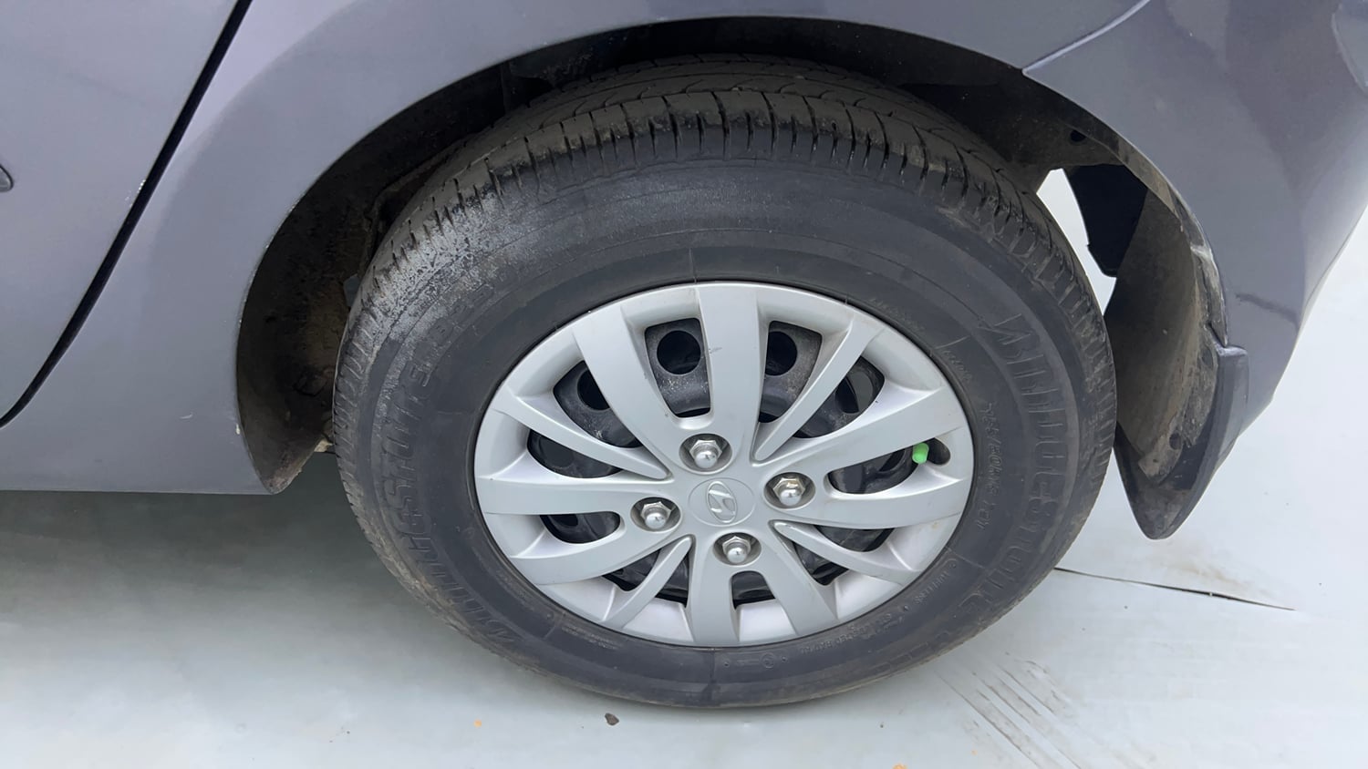 Used 2016 Hyundai i10 Sportz 1.1 iRDE2 Petrol Manual tyres LEFT REAR TYRE RIM VIEW