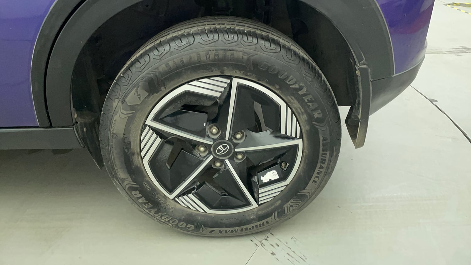 Used 2023 Tata Nexon Fearless Plus S Purple 1.2 Revotron Petrol 7DCA Dual Tone Petrol Automatic tyres LEFT REAR TYRE RIM VIEW