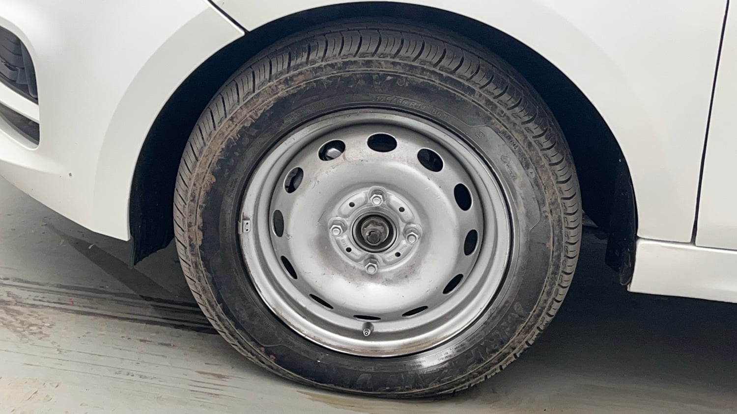 Used 2021 Tata Tiago XE Petrol Manual tyres LEFT FRONT TYRE RIM VIEW