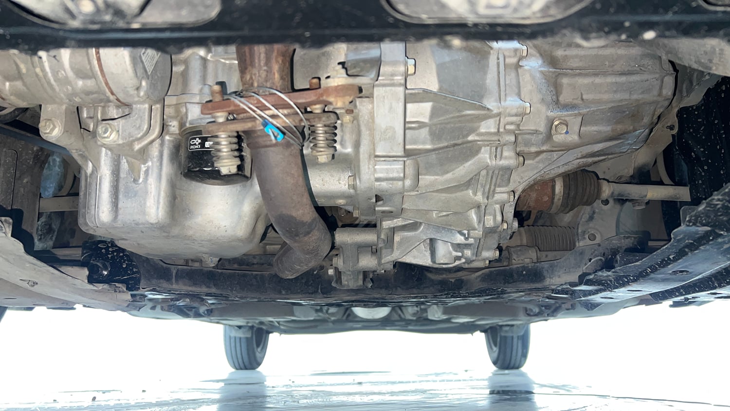 Used 2024 Maruti Suzuki Swift VXi (O) AMT Petrol Automatic extra FRONT LEFT UNDERBODY VIEW