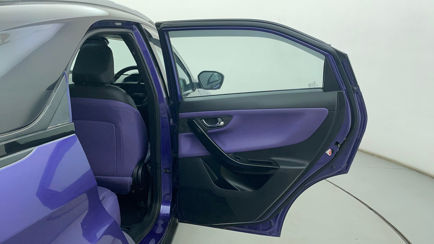 Used 2023 Tata Nexon Fearless Plus S Purple 1.2 Revotron Petrol 7DCA Dual Tone Petrol Automatic interior RIGHT REAR DOOR OPEN VIEW
