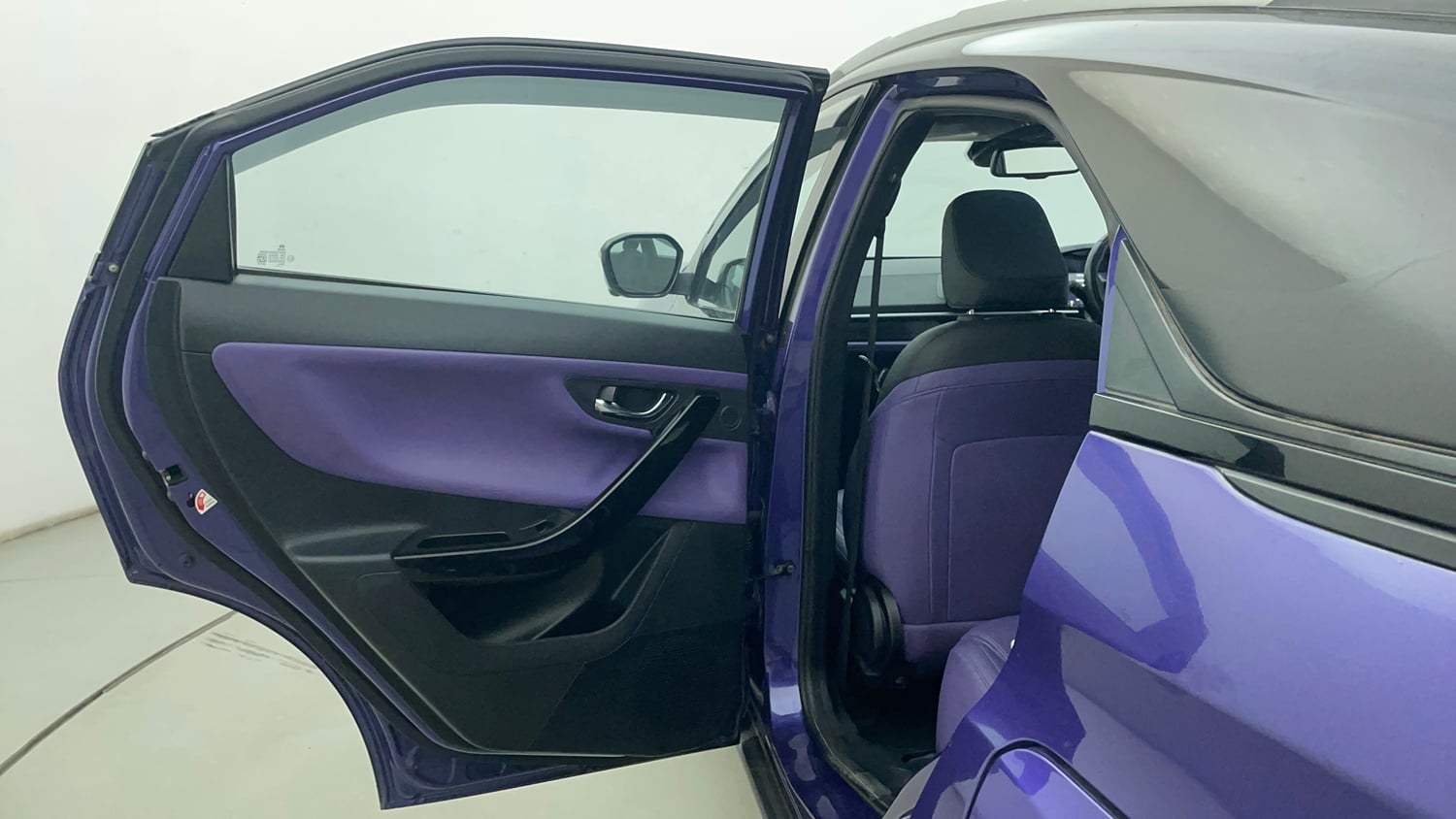 Used 2023 Tata Nexon Fearless Plus S Purple 1.2 Revotron Petrol 7DCA Dual Tone Petrol Automatic interior LEFT REAR DOOR OPEN VIEW