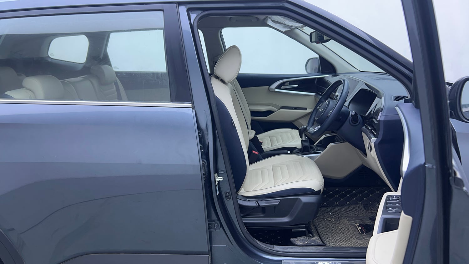 Used 2022 Kia Carens Luxury 1.4 Petrol 7 STR Petrol Manual interior RIGHT SIDE FRONT DOOR CABIN VIEW