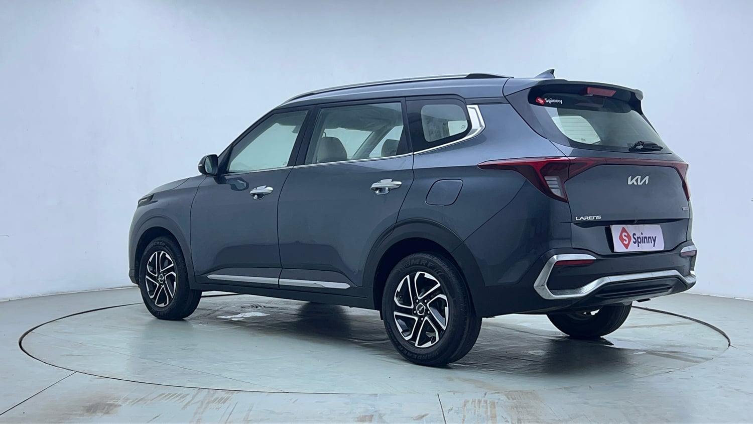 Used 2022 Kia Carens Luxury 1.4 Petrol 7 STR Petrol Manual exterior LEFT REAR CORNER VIEW