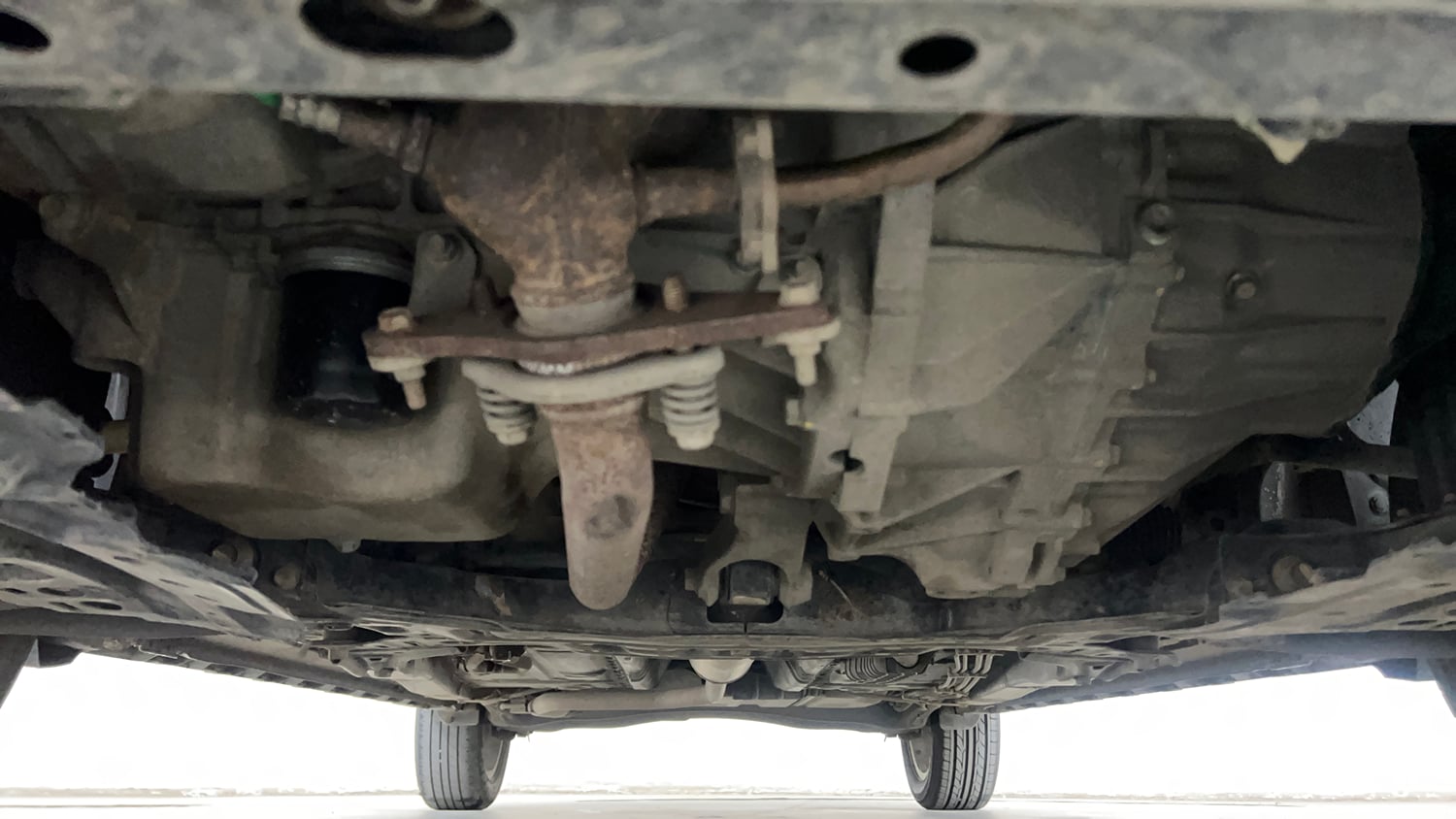 Used 2022 Maruti Suzuki XL6 Alpha MT Petrol Petrol Manual extra FRONT LEFT UNDERBODY VIEW