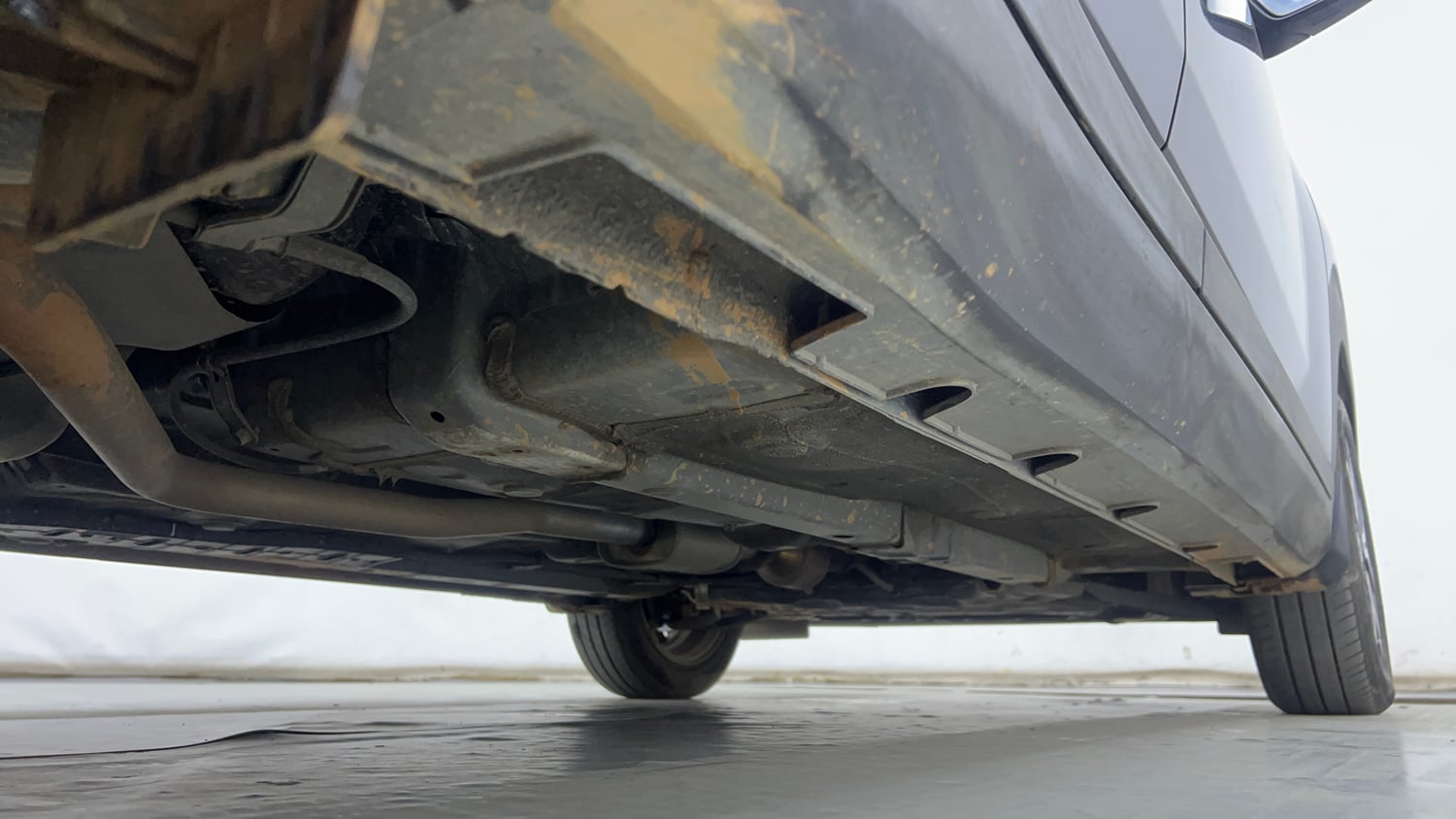 Used 2023 Hyundai Exter SX (O) 1.2 AMT Petrol Automatic extra REAR RIGHT UNDERBODY VIEW