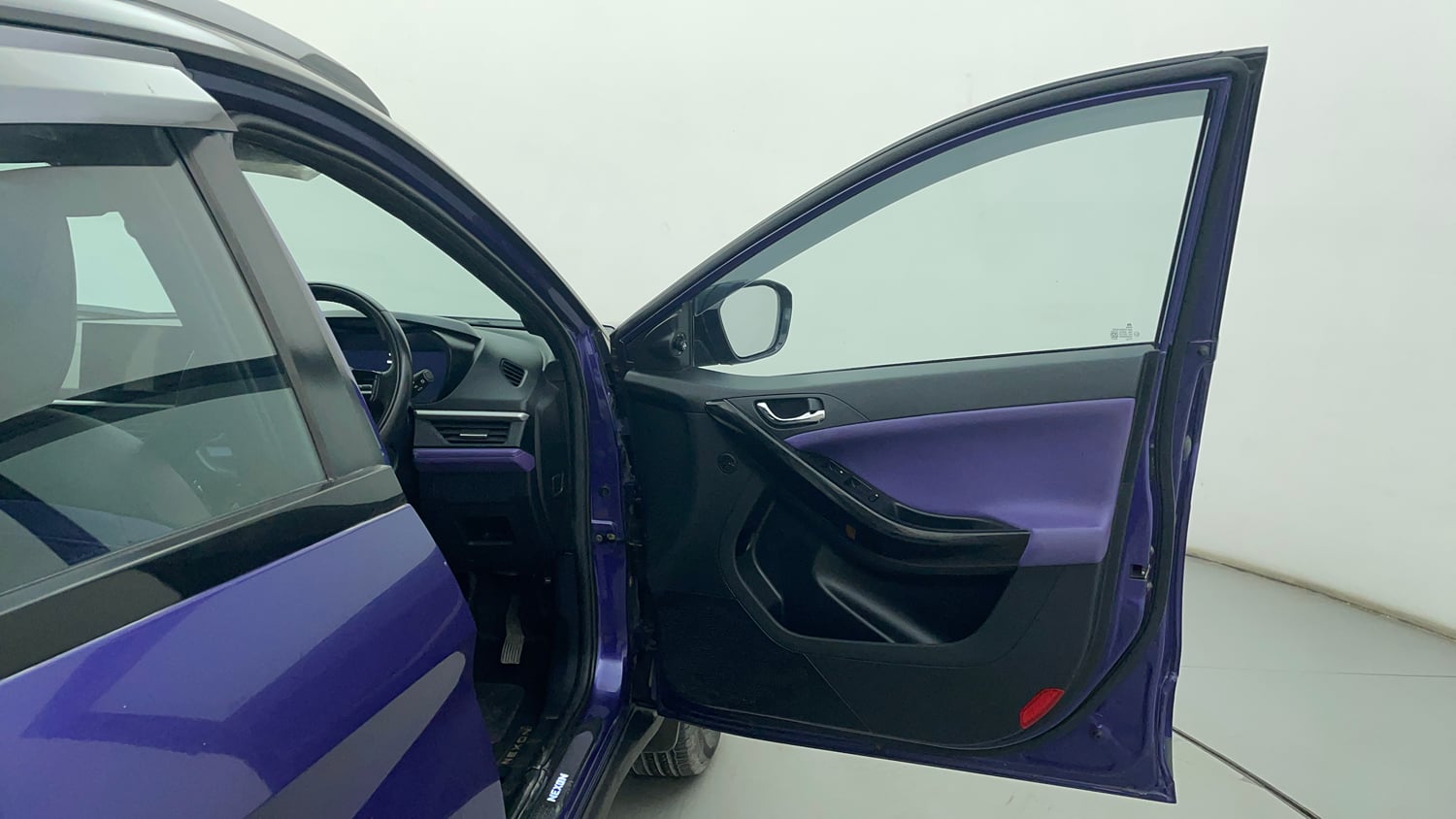 Used 2023 Tata Nexon Fearless Plus S Purple 1.2 Revotron Petrol 7DCA Dual Tone Petrol Automatic interior RIGHT FRONT DOOR OPEN VIEW