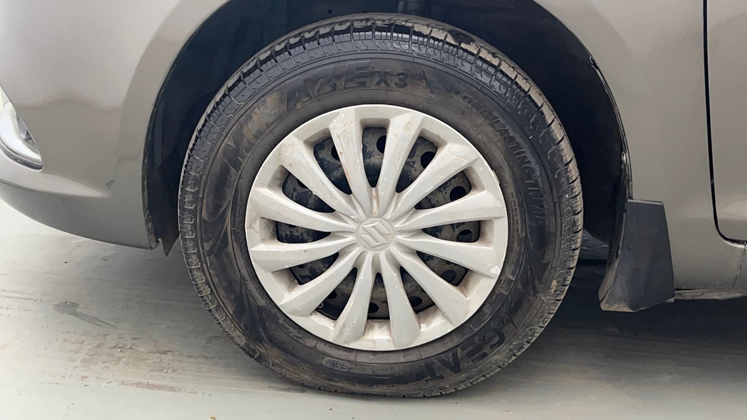 Used 2016 Maruti Suzuki Swift Dzire VXI Petrol Manual tyres LEFT FRONT TYRE RIM VIEW