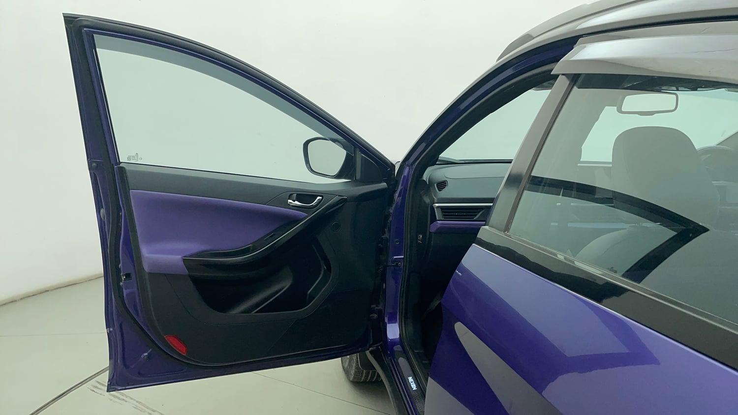 Used 2023 Tata Nexon Fearless Plus S Purple 1.2 Revotron Petrol 7DCA Dual Tone Petrol Automatic interior LEFT FRONT DOOR OPEN VIEW