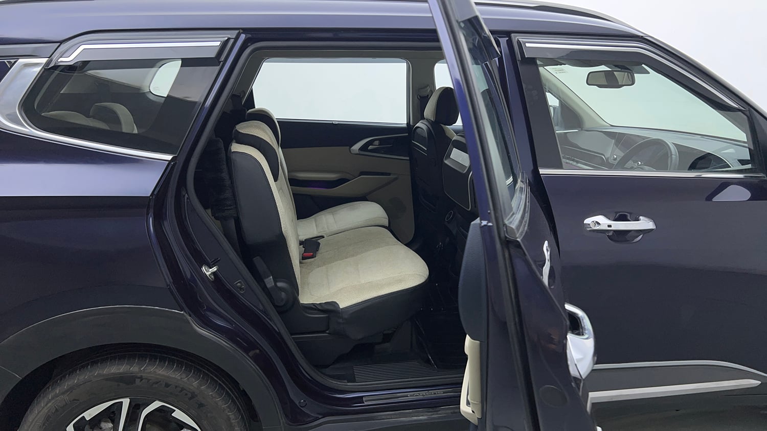 Used 2022 Kia Carens Luxury 1.4 Petrol 7 STR Petrol Manual interior RIGHT SIDE REAR DOOR CABIN VIEW