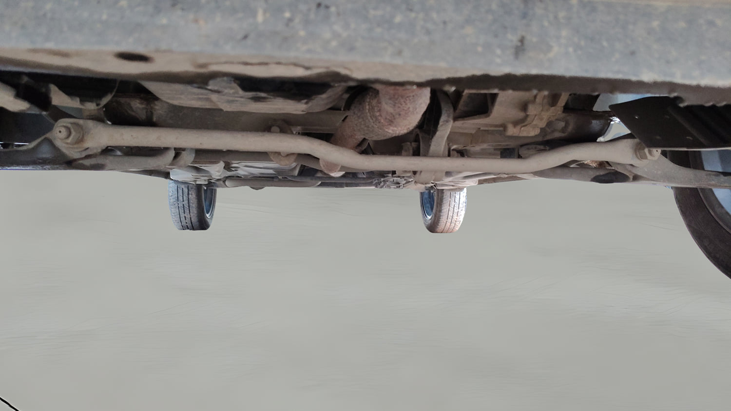 Used 2025 Tata Tigor XZ Plus LUX Petrol Manual extra FRONT LEFT UNDERBODY VIEW