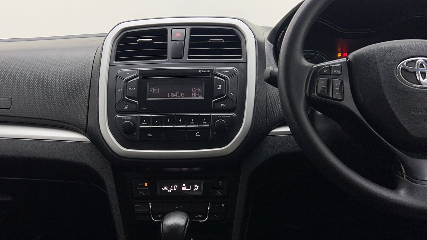 Used 2021 Toyota Urban Cruiser Mid Grade AT Petrol Automatic interior MUSIC SYSTEM & AC CONTROL VIEW