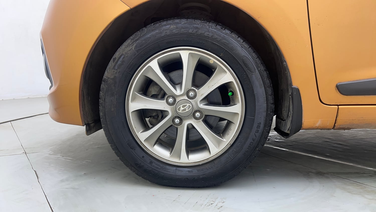 Used 2014 Hyundai Grand i10 Asta 1.2 Kappa VTVT Petrol Manual tyres LEFT FRONT TYRE RIM VIEW