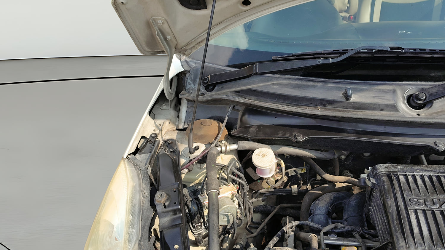 Used 2012 Maruti Suzuki Swift Dzire ZXI Petrol Manual engine ENGINE LEFT SIDE HINGE & APRON VIEW