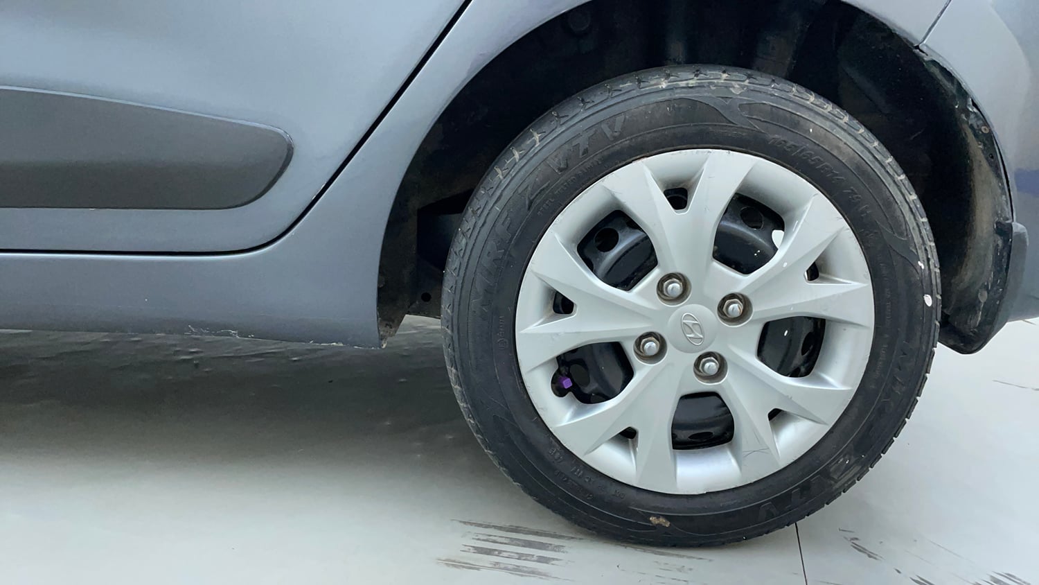 Used 2014 Hyundai Grand i10 Sportz 1.2 Kappa VTVT Petrol Manual tyres LEFT REAR TYRE RIM VIEW