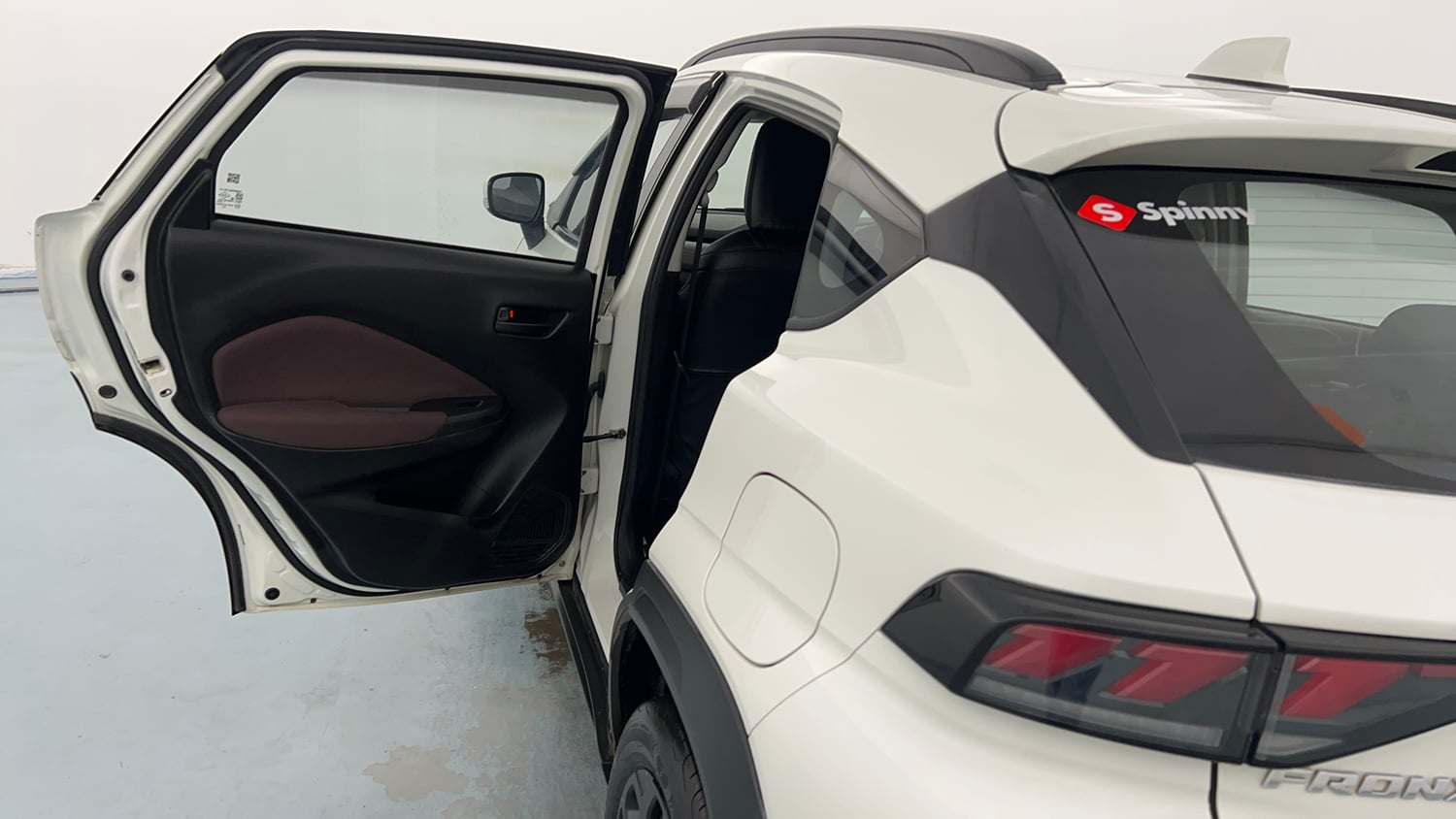 Used 2024 Maruti Suzuki Fronx Delta Plus 1.2L MT Petrol Manual interior LEFT REAR DOOR OPEN VIEW