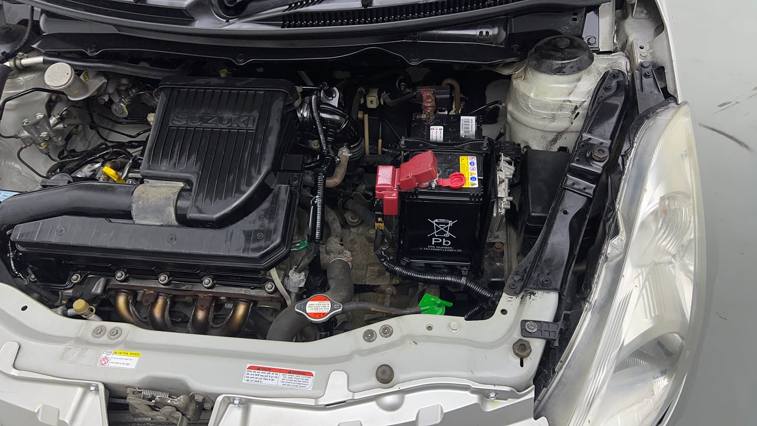 Used 2015 Maruti Suzuki Swift Lxi (O) Petrol Manual engine ENGINE LEFT SIDE VIEW