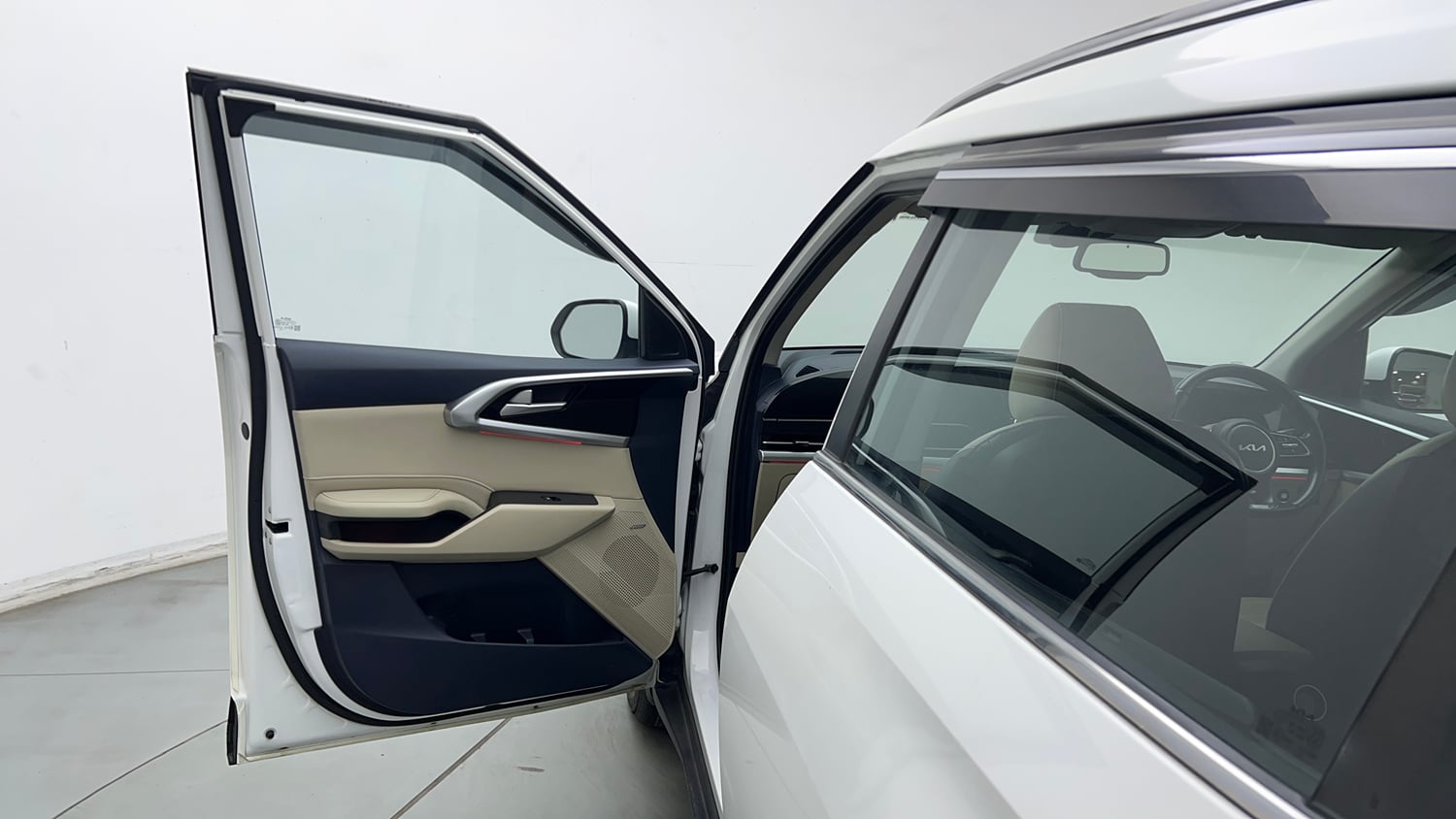 Used 2022 Kia Carens Luxury Plus 1.4 Petrol 7 STR Petrol Manual interior LEFT FRONT DOOR OPEN VIEW