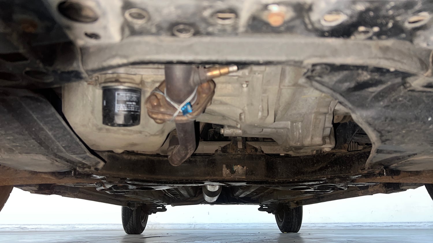 Used 2015 Maruti Suzuki Swift Lxi (O) Petrol Manual extra FRONT LEFT UNDERBODY VIEW