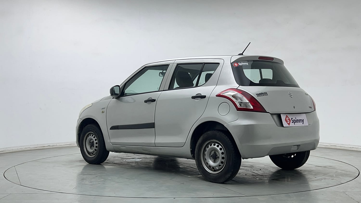 Used 2015 Maruti Suzuki Swift Lxi (O) Petrol Manual exterior LEFT REAR CORNER VIEW