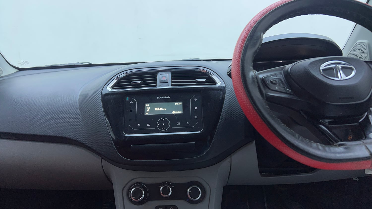 Used 2021 Tata Tiago XT Petrol Manual top_features Integrated (in-dash) music system
