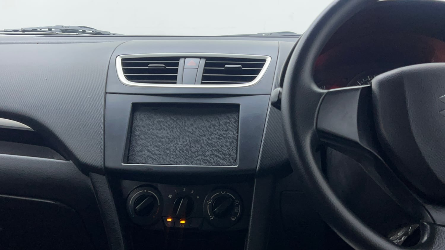 Used 2015 Maruti Suzuki Swift Lxi (O) Petrol Manual interior MUSIC SYSTEM & AC CONTROL VIEW