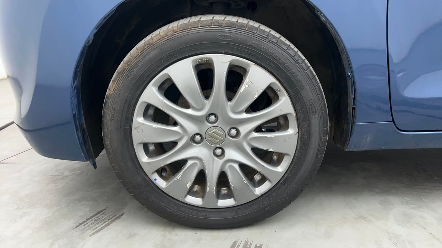 Used 2016 Maruti Suzuki Baleno Zeta 1.2 Petrol Manual tyres LEFT FRONT TYRE RIM VIEW