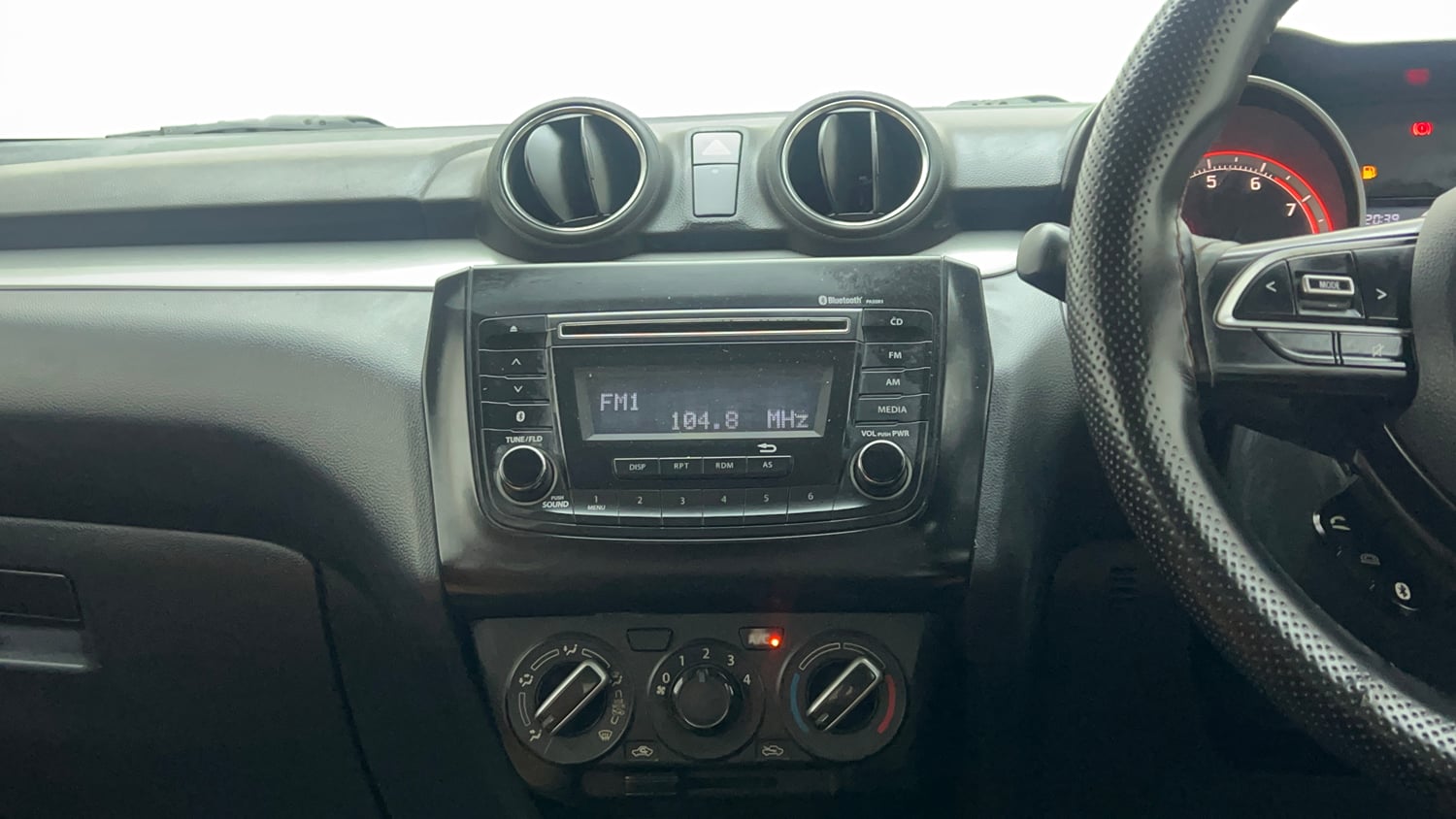 Used 2018 Maruti Suzuki Swift VXi Petrol Manual top_features Integrated (in-dash) music system