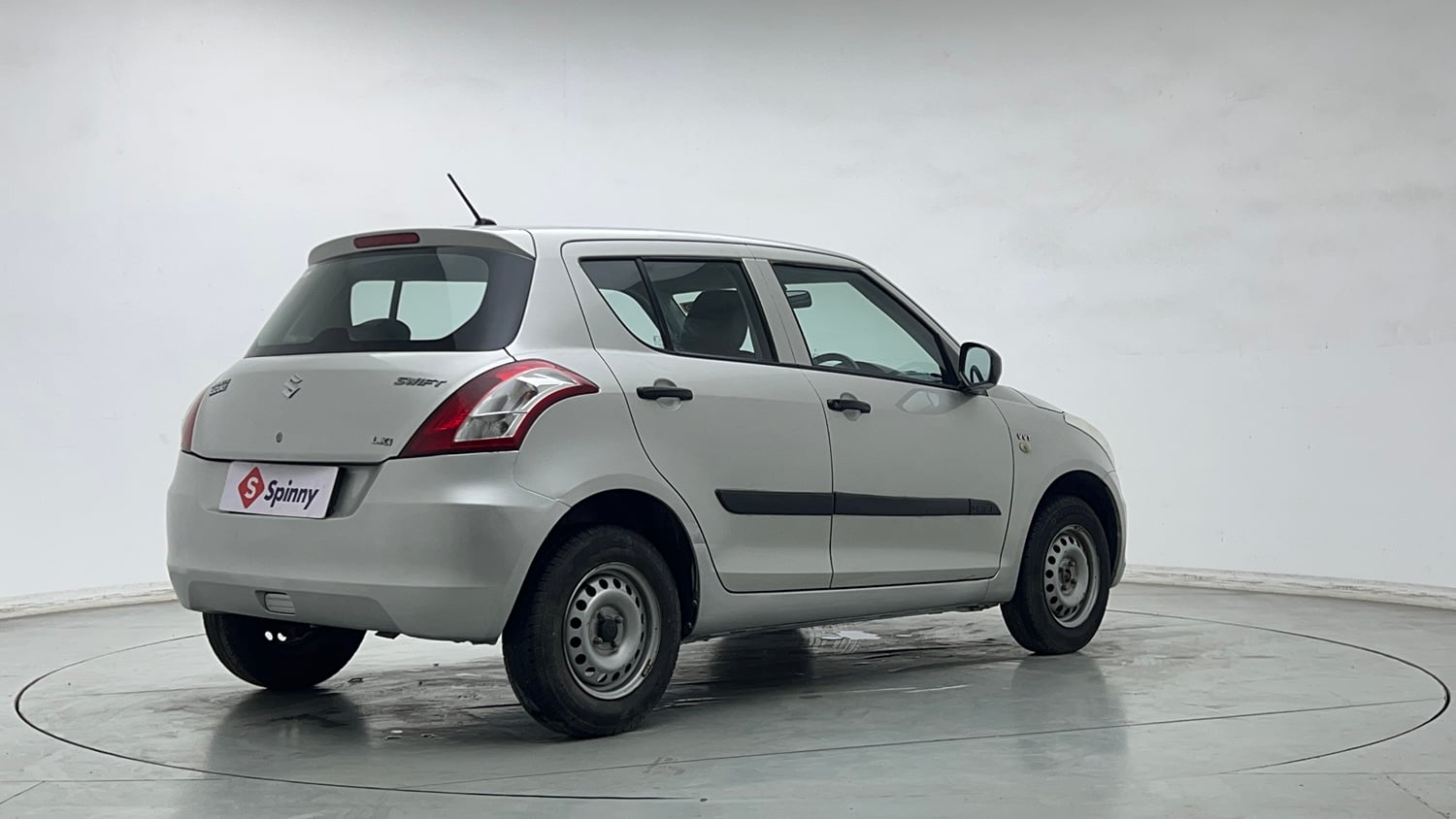 Used 2015 Maruti Suzuki Swift Lxi (O) Petrol Manual exterior RIGHT REAR CORNER VIEW