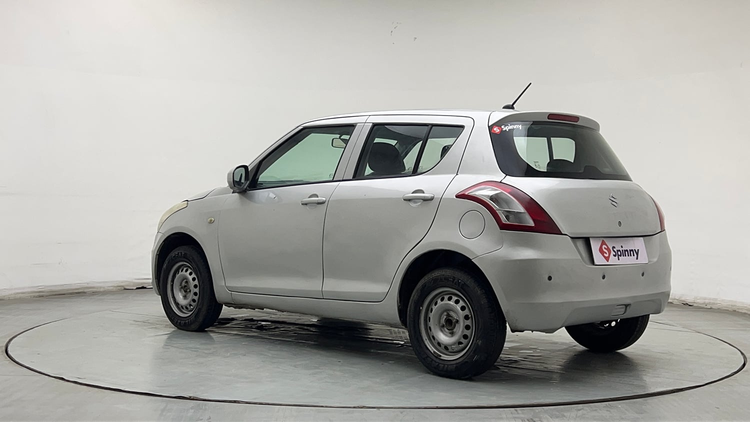 Used 2017 Maruti Suzuki Swift Lxi (O) Petrol Manual exterior LEFT REAR CORNER VIEW